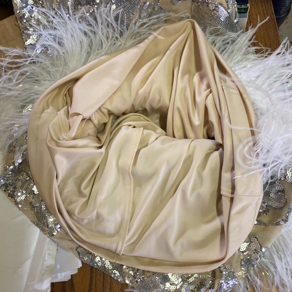 Who doesn’t need some feathers in their life? Beautiful silver cream formal - Picture 10 of 11